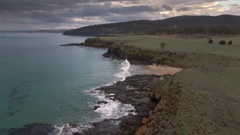 Dramatic Sunrise Over Kelvedon Beach, Tasmania After Night Storm – Drone 4K Stock Footage 311570394