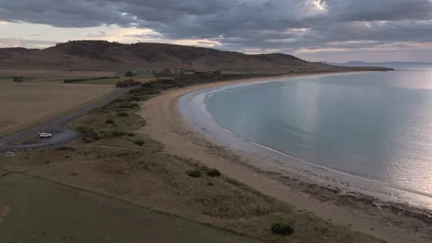 Dramatic Sunrise Over Kelvedon Beach, Tasmania After Night Storm – Drone 4K Stock Footage 311570403