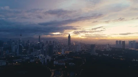 Dramatic sunrise over Kuala Lumpur cityscape.  動画素材 121125443