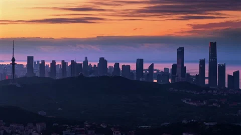 Dramatic Sunrise over Qingdao Cityscape and Ocean Stock Footage 330742305