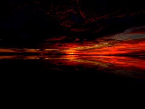 Dramatic Sunrise over Salt Flat Stock Footage 83385289