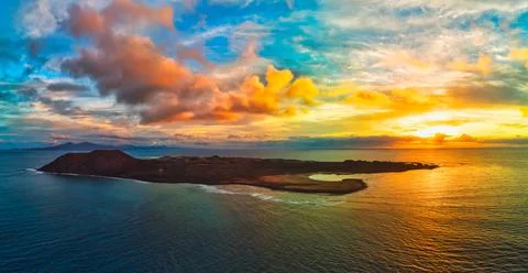 Dramatic sunrise panorama over Lobos island near Corralejo Stock Photos