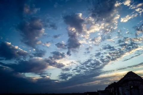 Dramatic sunrise sky with vibrant cloud cover over rural Andalusian country.. Stock Photos