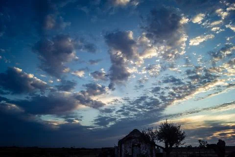 Dramatic sunrise sky with vibrant cloud cover over rural Andalusian country.. Stock Photos
