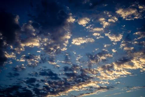 Dramatic sunrise sky with vibrant cloud cover over rural Andalusian country.. Stock Photos