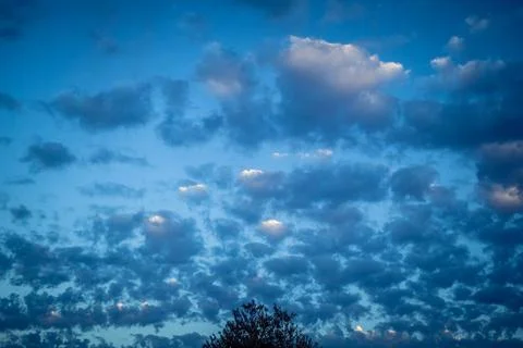 Dramatic sunrise sky with vibrant cloud cover over rural Andalusian country.. Stock Photos