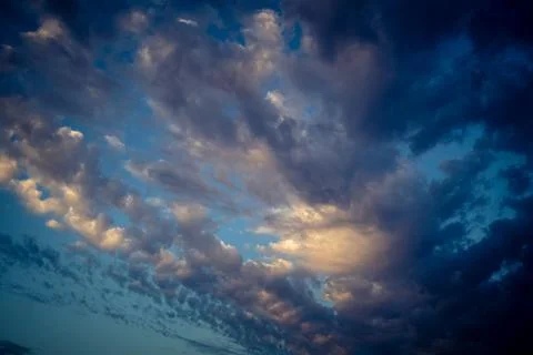 Dramatic sunrise sky with vibrant cloud cover over rural Andalusian country.. Stock Photos