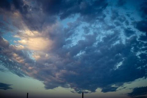 Dramatic sunrise sky with vibrant cloud cover over rural Andalusian country.. Stock Photos