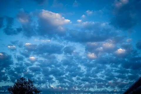 Dramatic sunrise sky with vibrant cloud cover over rural Andalusian country.. Stock Photos