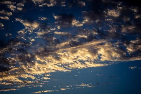 Dramatic sunrise sky with vibrant cloud cover over rural Andalusian country.. Stock Photos