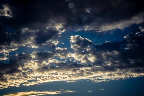 Dramatic sunrise sky with vibrant cloud cover over rural Andalusian country.. Stock Photos
