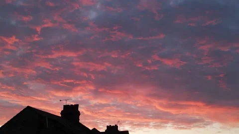 Dramatic sunrise with textured red clouds Stock Footage 237719162