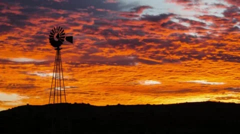 Dramatic sunrise with windmill Video stock 54241953