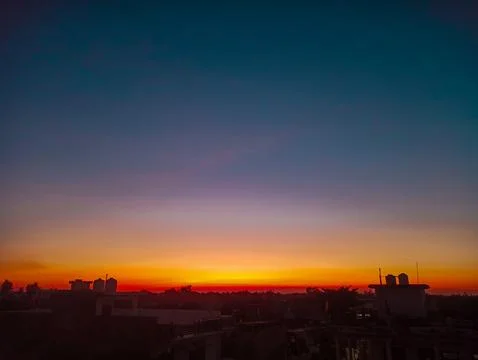 A dramatic sunset above the city after the rain. Fotos de archivo