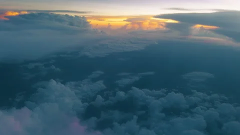 Dramatic Sunset Above the Clouds with Golden Light and Dark Blue Sky. Stock Footage 338360527