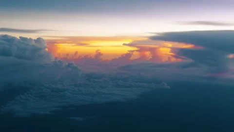 Dramatic Sunset Above the Clouds with Golden Light Breaking Through Cloudscape. Stock Footage 338360540