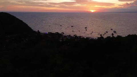 Dramatic sunset aerial Apo Island Philippines ocean horizon tropical landscape Stock Footage 332615788