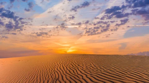 Dramatic sunset among a desert time lapse scene Stock Footage 264646950