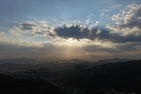 Dramatic Sunset and Crepuscular Rays over Zhangzhou Mountains Stock Photos