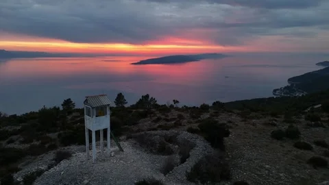 Dramatic sunset and watchtower on the hill. Coast. Drone. Stock Footage 303056346