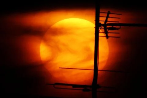 Dramatic sunset with antenna. 스톡 사진