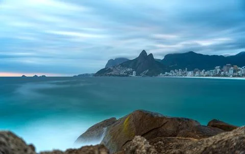 Dramatic Sunset on Arpoador Stone with Silky Ocean, Rio de Janeiro Stock Photos