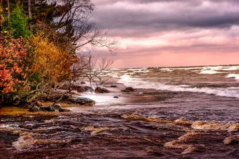 Dramatic sunset at Au Sable Beach in Lake Superior Stock Photos