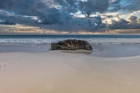Dramatic Sunset Beach with Rock and Ocean Waves, Oman Stock Photos