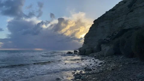 Dramatic sunset at the beach with rocks Stock Footage 255781809