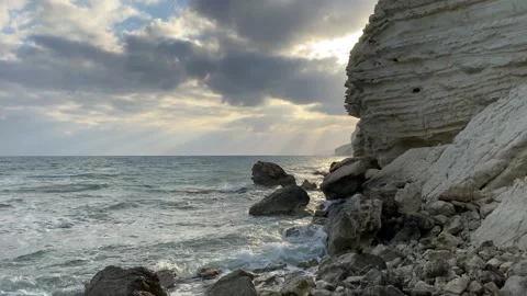 Dramatic sunset at the beach with rocks Stock Footage 255784356