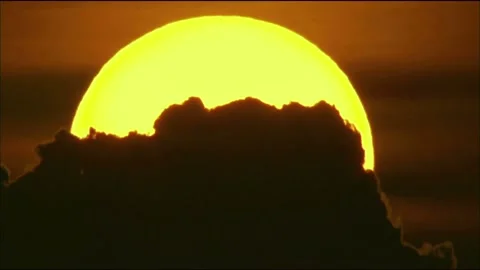 Dramatic Sunset Behind Clouds in Timelapse Video stock 327268834