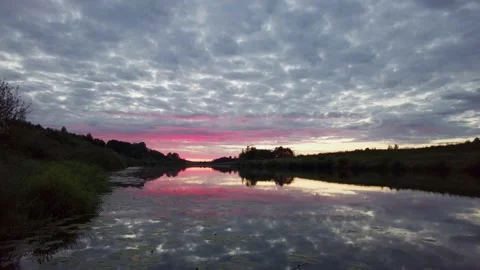 Dramatic sunset on the calm river Video stock 159565894