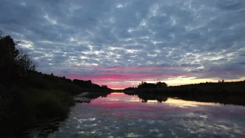 Dramatic sunset on the calm river Stock Footage 159586921