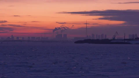 Dramatic sunset casting soft light across the frozen water Video stock 328695056