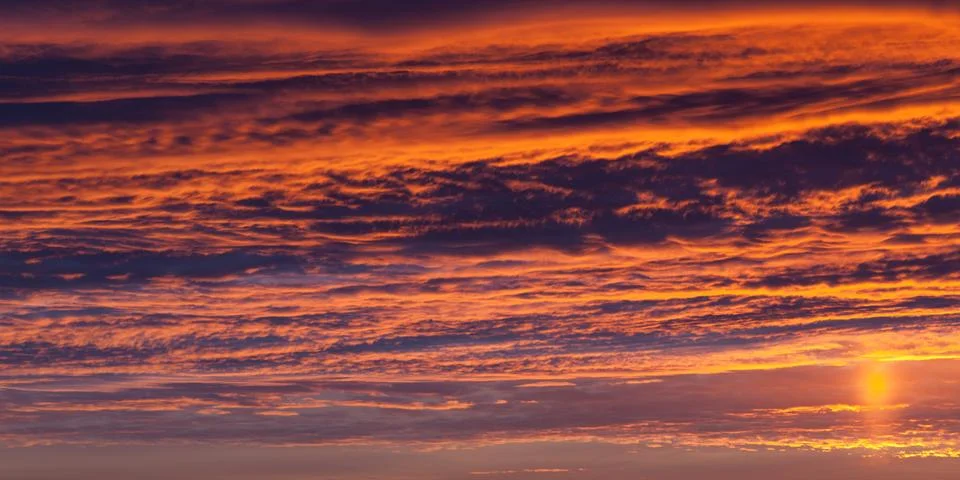 Dramatic sunset on cloud sky Stock Photos