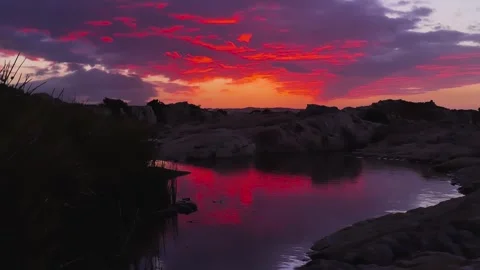 Dramatic sunset cloud time lapse reflection Stock Footage 345829548