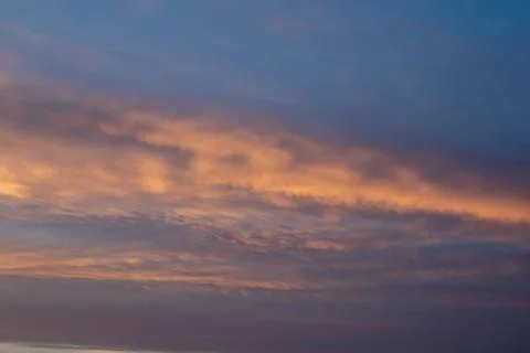 Dramatic Sunset Clouds in Blue Sky Stock Photos