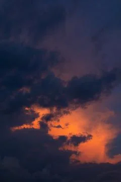 Dramatic Sunset Clouds in Deep Blue and Orange Stock Photos