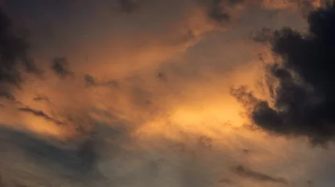 Dramatic Sunset Clouds in Fiery Orange and Dark Tones 스톡 사진
