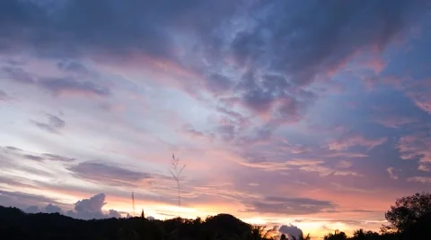 Dramatic sunset clouds with foliage in silhouette - Time lapse Stock Footage 42761064