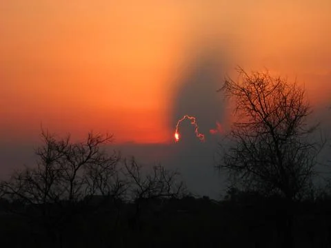 Dramatic Sunset Clouds Forming Wing-Like Shapes in the Sky Stock Photos