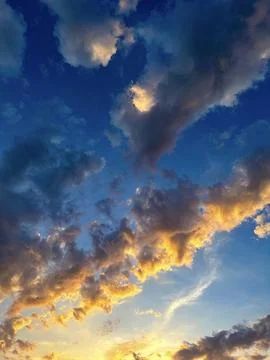 Dramatic Sunset Clouds with Golden Edges Stock Photos