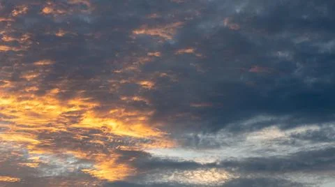 Dramatic Sunset Clouds With Golden Hues Stock Photos