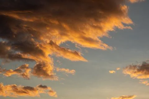 Dramatic Sunset Clouds in Golden Light Stock Photos