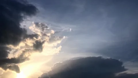 Dramatic Sunset Clouds in Motion Time Lapse with Airplane Coming Out of Clouds Stock Footage 310179077