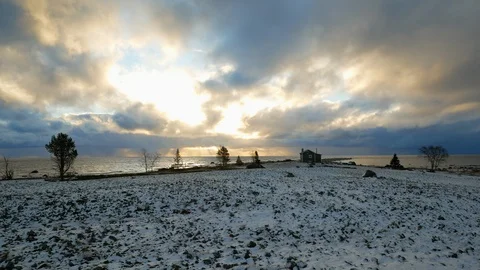 Dramatic sunset clouds moving at the ocean in winter Stock Footage 98361543