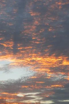 Dramatic Sunset Clouds in Orange and Gray Stock Photos
