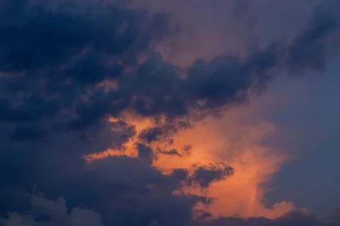 Dramatic Sunset Clouds in Orange and Blue Stock Photos