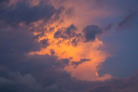 Dramatic Sunset Clouds with Orange Glow Stock Photos