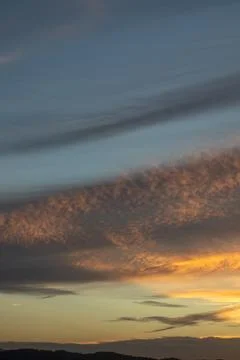 Dramatic Sunset Clouds Over Landscape Stockfoto's